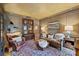Classic living room featuring paneled walls, hardwood floors, and comfortable leather seating at 12028 Royal Lytham Ct, Charlotte, NC 28277