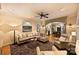 Bright living room with an open floor plan leading to a kitchen, featuring a cozy seating area at 12028 Royal Lytham Ct, Charlotte, NC 28277
