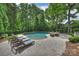 Relaxing pool area with lounge chairs and outdoor seating, perfect for enjoying sunny days at 12028 Royal Lytham Ct, Charlotte, NC 28277