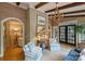 Cozy sitting area with stylish decor, comfortable seating, and arched doorway at 12028 Royal Lytham Ct, Charlotte, NC 28277