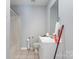 Cozy bathroom featuring a shower with plastic curtain, toilet, and vanity with white cabinets at 1263 Crawford Rd, Rock Hill, SC 29730