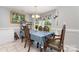 Bright dining room featuring tile floors, a chandelier, and large windows with floral valances at 1263 Crawford Rd, Rock Hill, SC 29730