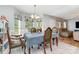 Bright dining room featuring tile floors, a chandelier, and large windows with floral valances at 1263 Crawford Rd, Rock Hill, SC 29730