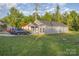 A charming gray home with a well-manicured lawn and driveway, surrounded by lush trees at 1263 Crawford Rd, Rock Hill, SC 29730