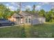 A charming gray home with a well-manicured lawn and driveway, surrounded by lush trees at 1263 Crawford Rd, Rock Hill, SC 29730