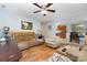 Cozy living room featuring plush leather seating, wood laminate flooring and a ceiling fan at 1263 Crawford Rd, Rock Hill, SC 29730