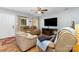 Cozy living room featuring plush leather seating, wood laminate flooring and a ceiling fan at 1263 Crawford Rd, Rock Hill, SC 29730