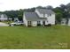 Spacious backyard with lush green grass, perfect for outdoor activities at 12803 Matisse Ln, Charlotte, NC 28215