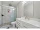 A modern bathroom featuring a glass shower, single sink, and updated fixtures at 12803 Matisse Ln, Charlotte, NC 28215