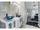 Modern bathroom featuring vessel sinks, stylish fixtures, and views to the main bedroom at 12803 Matisse Ln, Charlotte, NC 28215