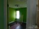Bright bedroom with green walls and natural light at 12803 Matisse Ln, Charlotte, NC 28215