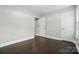 Clean bedroom featuring wood floors, neutral paint and ample closet space at 12803 Matisse Ln, Charlotte, NC 28215