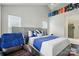 Spacious bedroom with a plush bed, ceiling fan, and ample natural light at 12803 Matisse Ln, Charlotte, NC 28215