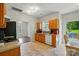 Well-lit kitchen featuring updated appliances, functional layout, and easy access to backyard at 12803 Matisse Ln, Charlotte, NC 28215
