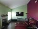 Cozy living room featuring a fireplace and comfortable seating at 12803 Matisse Ln, Charlotte, NC 28215