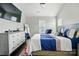 A comfy main bedroom with a king-size bed and a modern dresser and TV at 12803 Matisse Ln, Charlotte, NC 28215