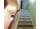 Staircase with handrail to upper level at 12803 Matisse Ln, Charlotte, NC 28215