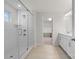 A clean and modern bathroom features a glass-enclosed shower and double vanity with a walk-in closet view at 1287 Fishing Creek Rd, Lake Wylie, SC 29710