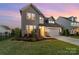 A beautiful two-story home with stone accents, a well-maintained lawn, and an attached two-car garage at 1287 Fishing Creek Rd, Lake Wylie, SC 29710