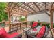 Back deck with outdoor seating, a pergola, and a view of the home's exterior at 13312 Edgetree Dr, Pineville, NC 28134