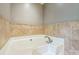 Modern bathtub featuring tile surround at 13312 Edgetree Dr, Pineville, NC 28134