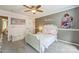 Bright bedroom with a decorative headboard, stylish wall decor, and fresh paint at 13312 Edgetree Dr, Pineville, NC 28134