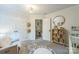 Cozy Bedroom featuring a round alphabet rug, plush chair, and ample storage at 13312 Edgetree Dr, Pineville, NC 28134