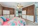 Spacious bedroom with custom built-in shelves, cabinets, and a window seat at 13312 Edgetree Dr, Pineville, NC 28134