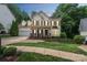 Charming two-story home featuring well-manicured lawn, and a welcoming porch at 13312 Edgetree Dr, Pineville, NC 28134