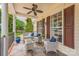 Close-up view of a charming front porch, offering a relaxing sitting area at 13312 Edgetree Dr, Pineville, NC 28134