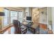Cozy office space featuring a wooden desk, ergonomic chair, and large bay window at 13312 Edgetree Dr, Pineville, NC 28134