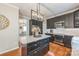 Beautiful kitchen features an island, custom cabinetry, and updated appliances at 13312 Edgetree Dr, Pineville, NC 28134