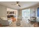 Open concept living room with views into the kitchen and sunroom at 13312 Edgetree Dr, Pineville, NC 28134