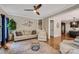 Comfortable living room with a fireplace, modern furnishings, and an adjacent kitchen at 13312 Edgetree Dr, Pineville, NC 28134