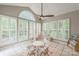 Bright sunroom with plenty of natural light, vaulted ceiling, and stylish decor at 13312 Edgetree Dr, Pineville, NC 28134