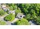 Aerial view of house in wooded neighborhood at 13914 Loch Loyal Dr, Charlotte, NC 28273