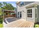 Well-maintained back deck with pergola and mature trees around at 13914 Loch Loyal Dr, Charlotte, NC 28273