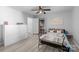 A room with a bed, a dresser, side table, chair, ceiling fan and closet with white door at 13914 Loch Loyal Dr, Charlotte, NC 28273
