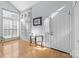 Bright entryway with a glass table, wood floors, and a large window with lots of natural light at 13914 Loch Loyal Dr, Charlotte, NC 28273