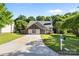 Charming home with brick and siding exterior, well-manicured lawn, and inviting front entrance at 13914 Loch Loyal Dr, Charlotte, NC 28273