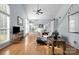 Open living space featuring hardwood floors, fireplace, staircase, and lots of natural light from many windows at 13914 Loch Loyal Dr, Charlotte, NC 28273