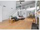 Spacious living room featuring hardwood floors, a fireplace, staircase, and a view into the dining area at 13914 Loch Loyal Dr, Charlotte, NC 28273