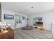 Bright living room with modern decor, light gray wood-look flooring and lots of natural light at 13914 Loch Loyal Dr, Charlotte, NC 28273