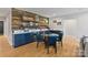 Stylish bar area featuring custom cabinetry, a sleek countertop, and a cozy dining table at 14218 Morningate St, Huntersville, NC 28078