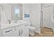 Modern bathroom with white vanity, quartz countertop, and a separate shower at 14218 Morningate St, Huntersville, NC 28078
