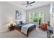 Cozy bedroom with neutral decor, natural light, and comfortable furnishings at 14218 Morningate St, Huntersville, NC 28078