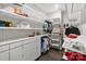 Organized walk-in closet with custom shelving and storage solutions, maximizing space and accessibility for wardrobe at 14218 Morningate St, Huntersville, NC 28078