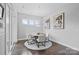 Elegant dining room with modern chandelier, round table, and contemporary artwork at 14218 Morningate St, Huntersville, NC 28078