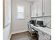 Bright home office with built-in cabinets, a clean desk space, and natural light at 14218 Morningate St, Huntersville, NC 28078