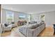 Bright living room with a comfortable sofa, large windows, and stylish decor for a modern look at 14218 Morningate St, Huntersville, NC 28078
